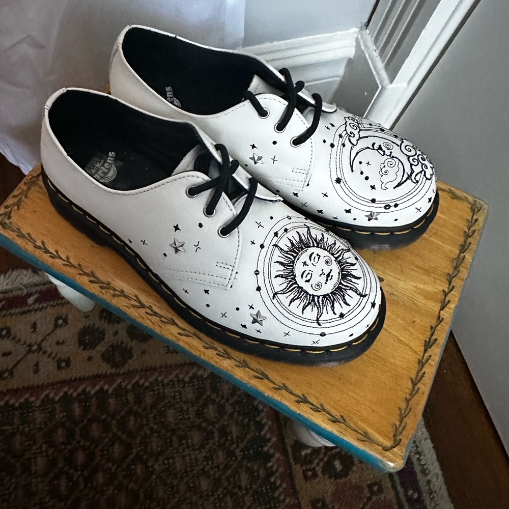 White embroidered Dr. Marten’s lace ups